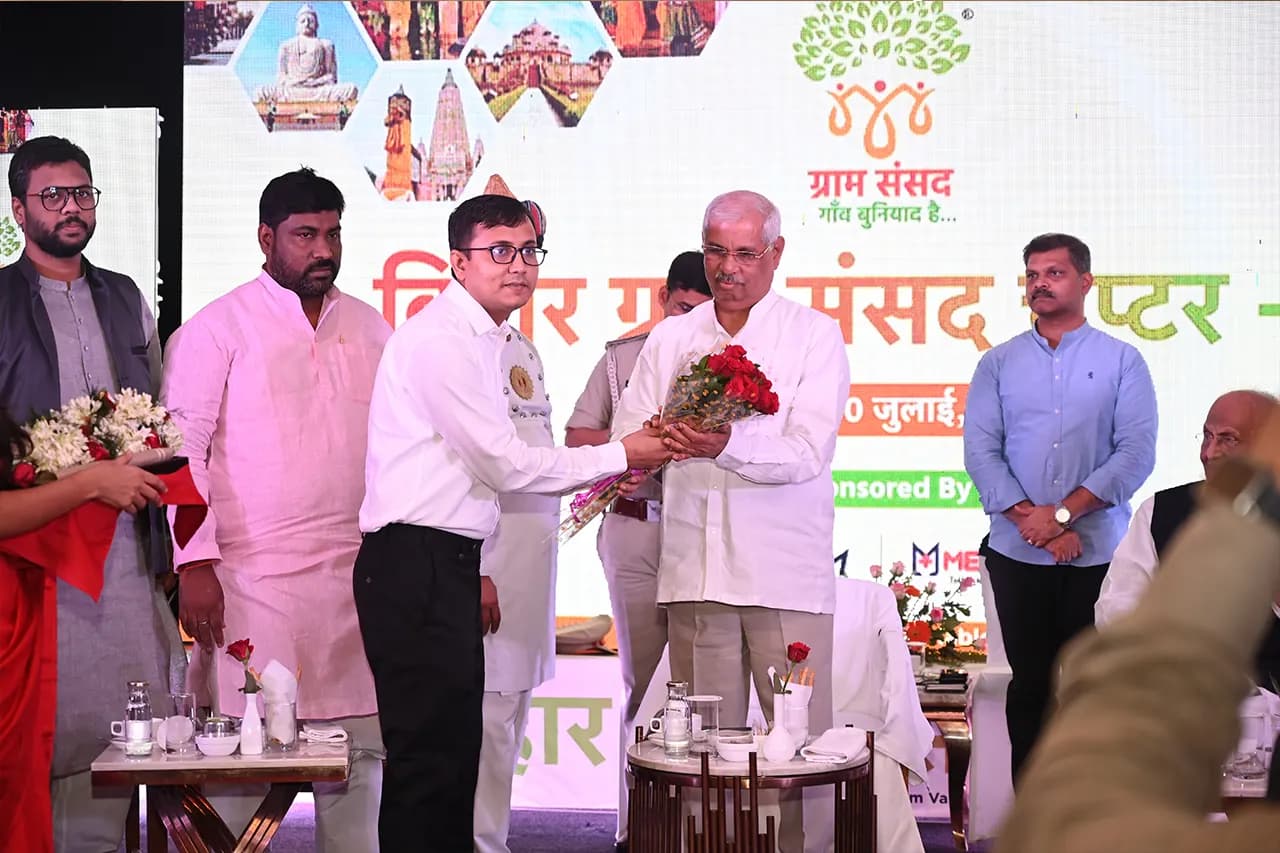 Presenting flowers on the Bihar Chapter stage