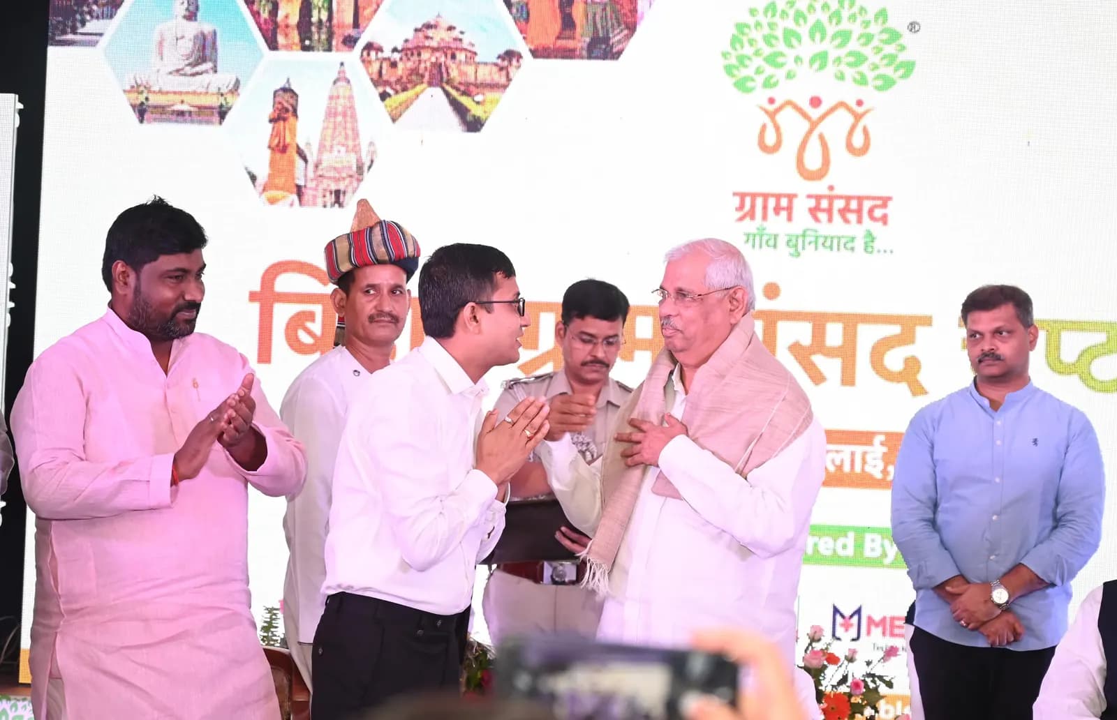 Greeting a senior dignitary on the Bihar Chapter stage