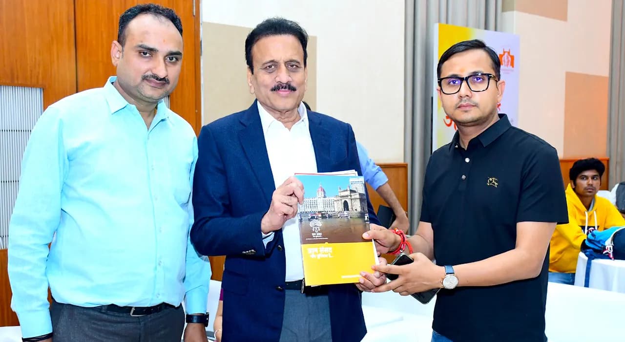Sharing the Gram Sansad booklet with a leader