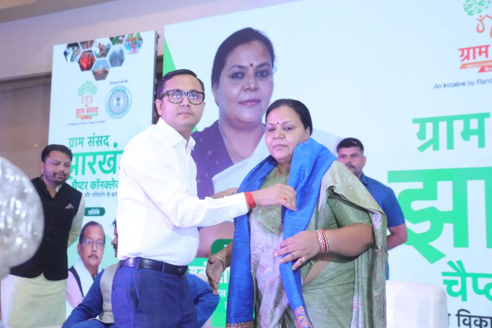 Felicitating the chief guest with a stole